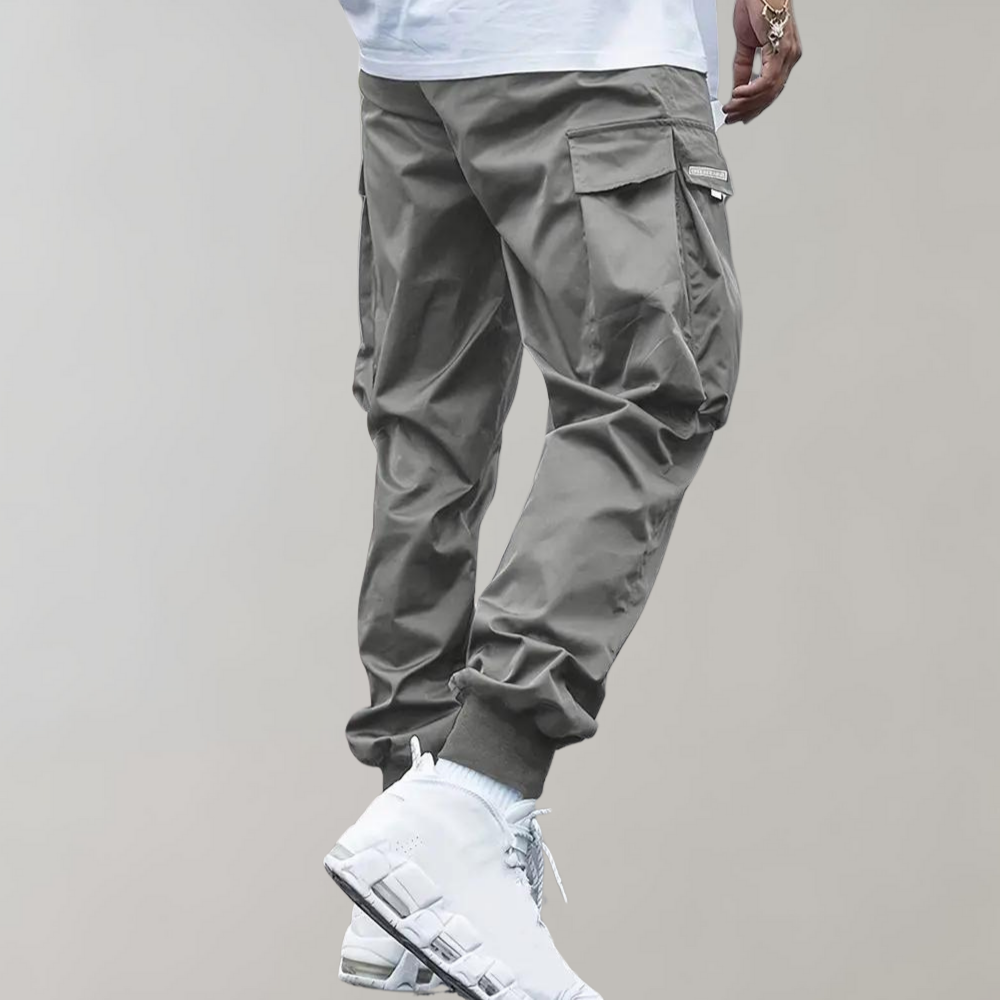 Winterfeld™ | Herren Cargo Jogginghose – Lila Streetwear-Hose mit Reißverschlusstaschen & Bündchen